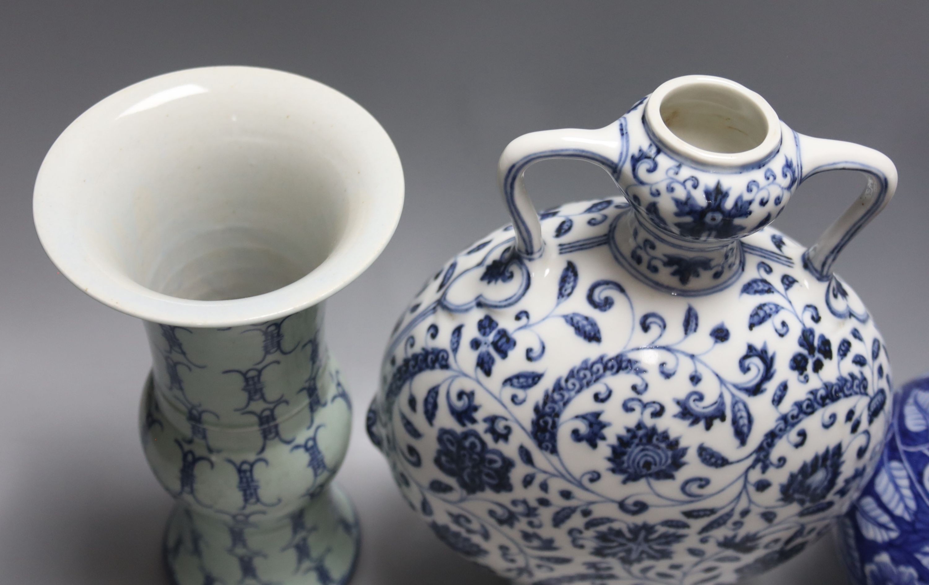 Two Chinese blue and white vases and a similar moon flask, moon flask 28 cms high.